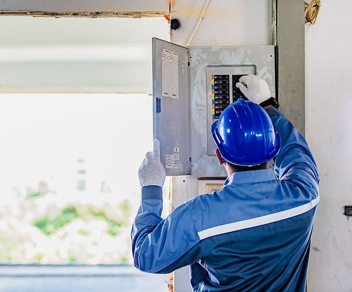 Electrician working on an Electric Panel