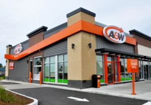 A&W Gloucester restaurant electrical buildout in Ottawa showing completed exterior signage, lighting, and drive-through area.
