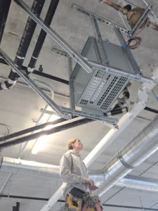 A&W Restaurant ceiling-mounted transformer installation with support framing and HVAC coordination during electrical buildout.