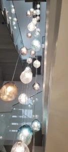 Custom glass pendant chandelier installed in Rockcliffe stairwell