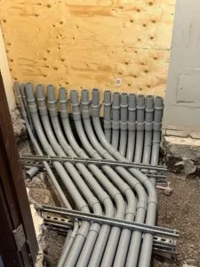 University of Ottawa Senate Room renovation showing multiple electrical conduit runs in an open floor trench.