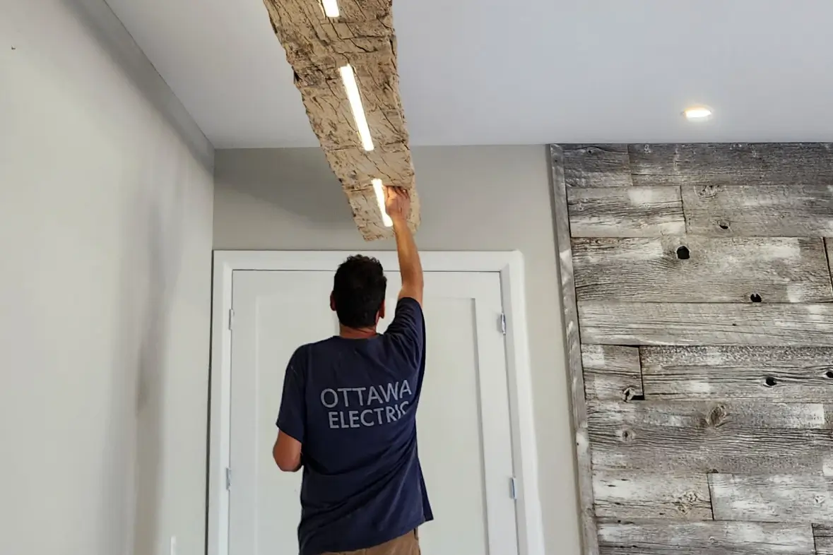 Ottawa electrician installing recessed lighting in modern residential home ceiling