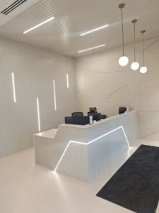 Dental & Plastic Surgery Facility reception area with custom LED lighting, pendant fixtures, and finished medical fit up.