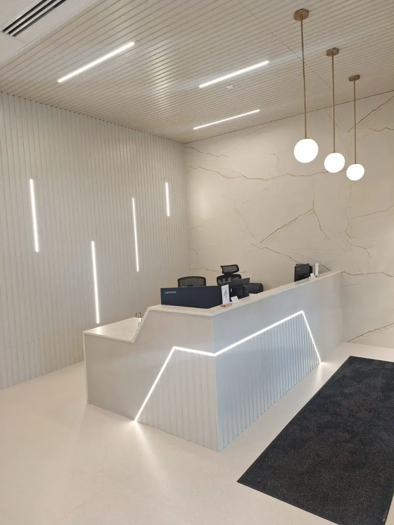 Dental & Plastic Surgery Facility reception area with custom LED lighting, pendant fixtures, and finished medical fit up.