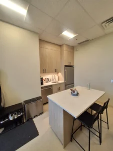 Dental & Plastic Surgery Facility staff kitchenette with LED ceiling lights, appliance power, cabinetry, and finished medical fit up.