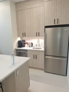 Dental & Plastic Surgery Facility staff kitchenette with under cabinet lighting, appliance power, sink, and finished medical electrical fit up.