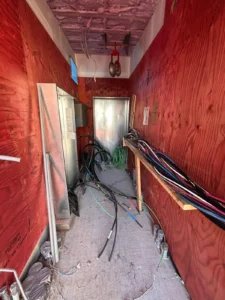 450 Booth Street electrical room rough-in with service wiring, conduit, and cable runs during construction.