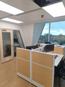 Ottawa Nurse Practitioner-Led Clinic office area with LED panel lighting, fire alarm device, and finished electrical upgrades.