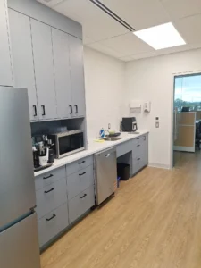 Ottawa Nurse Practitioner-Led Clinic kitchenette with LED ceiling panel lighting, appliance power, and finished electrical upgrades.