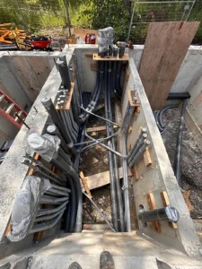 450 Booth Street underground conduit installation for electrical distribution between stacked rental units during construction.