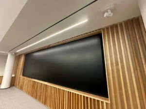 University of Ottawa Senate Room presentation wall with linear LED lighting and wood slat finishes.