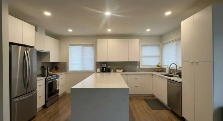 Modern kitchen with recessed pot lights providing ambient ceiling illumination
